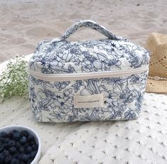 Introducing our Coastal Personalized Makeup Bag, crafted with a coastal-inspired design complete with an initial charm for that extra touch of individuality with a coastal inspired design with deep blues reminiscent of coastal shores giving a timeless beachy vibe. Its roomy interior is designed to hold all your makeup must-haves, skincare essentials, or toiletry necessities, staying organized has never been easier. Whether you're packing for a weekend getaway or simply channeling beach vibes at Coastal Makeup, Beachy Makeup, Personalized Makeup Bag, Personalized Makeup Bags, Skincare Essentials, Makeup Must Haves, Blue Makeup, Makeup Bags, Toiletry Storage