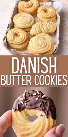 there is a hand holding a chocolate covered doughnut with the words danish butter cookies above it