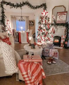 a living room decorated for christmas with presents