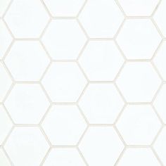 a white hexagonal tile wallpaper pattern