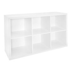 a white bookcase with six cubbys on it