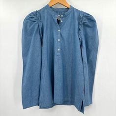 J. Crew Chambray Blue Ruffle Long Sleeve Popover Denim Small Blouse Nwt - New With Tags - Size: Small - Color: Blue Lightweight Chambray Blue Popover Blouse With Relaxed Hem And Ruffle Detail. - Popover - 1/4 Button Front Please See Pic For Approximate Measurements Laying Flat Style Detail Preppy Chambray Denim Ruffle Classic Denim Shirt Jj Long Sleeve Denim Blue Top With Ruffles, Long Sleeve Denim Top With Ruffles, Denim Blue Cotton Workwear Blouse, Blue Long Sleeve Denim Top With Ruffles, Denim Blue Cotton Blouse For Work, Blue Ruffled Long Sleeve Denim Top, Denim Blue Cotton Top With Ruffles, Blue Denim Blouse With Ruffles, Light Wash Cotton Blouse With Ruffles