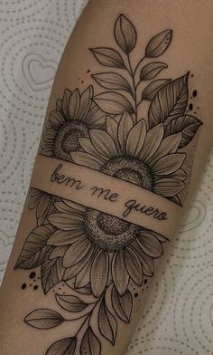 a sunflower tattoo on the arm with a ribbon that says, you're gone