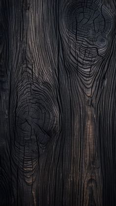 the wood texture is very dark and it looks like an old piece of wood that has been