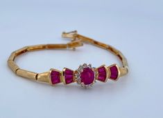 "Welcome To Gold Knox Beautiful and elegant  vintage 14k yellow gold bracelet with rubies and diamonds Great details and perfect gift idea for engagement or wedding Details Below; Material               14k yellow gold, red ruby, diamond,  Ruby                     1-1.5 ct Diamond              0.20 ct approximately  Length                 7\" long Width                   9 mm Hallmark              14K, (WI?) Please, be sure to view the pictures carefully as it is the exact item you are buying.  This would make great addition to your vintage silver collection. Thank you for looking Gold Knox opened its storefront in Pasadena, CA in 2011, since then we have an online store on eBay, and we joined Etsy in 2016 where we offer our  unique and desirable items for you. Most all our items are vinta Elegant Red Gold Bracelet For Formal Occasions, Elegant 14k Gold Red Bracelet, Gold Ruby Diamond Bracelet For Wedding, Wedding Gold Ruby Diamond Bracelet, Rubies And Diamonds, Wedding Jewelry Bracelets, Yellow Gold Bracelet, Ruby Diamond, Red Ruby