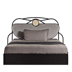 a bed with a metal frame and headboard, made in the style of art deco