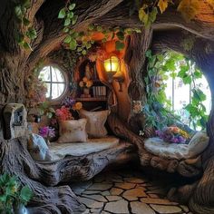 the inside of a tree house with flowers and plants