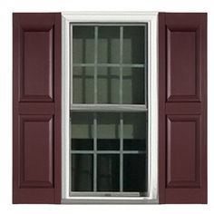 an open window with red shutters and white trim on the bottom half of it