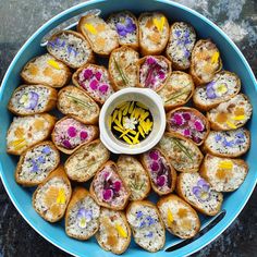 a blue bowl filled with lots of food