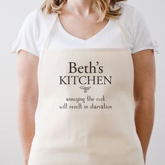 a woman wearing an apron that says beth's kitchen among the cooks will result in plantation