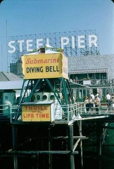 there is a sign that says diving bell on the pier