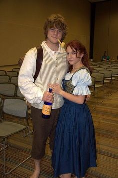 a man and woman dressed up in costume