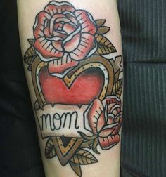 a rose and heart tattoo with the word mom on it