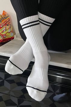 Le Bon Shoppe Boyfriend socks in classic white with black stripes. Stay fly all year long in these calf length sports socks. Pair with sneakers or sliders. Perfect for work from home. One size fits most. 85% cotton, 13% polyester, 2% spandex. Fair trade made in Korea. PIPE AND ROW Socks Outfit Sneakers, Boyfriend Socks, The Boyfriend, Sports Socks, Closet Staples, Long Socks, Men Fashion Casual Outfits, White Sock, Sport Socks