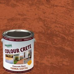 a can of paint sitting on top of a wooden floor