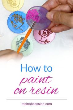 someone is painting on some buttons with the words, how to paint on resinon