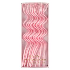 pink plastic straws in a box on a white background