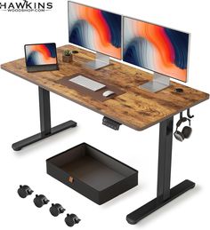 a computer desk with two monitors and a laptop on it, all connected to the same stand