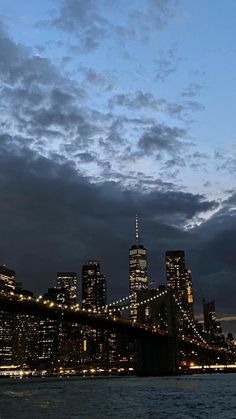 the city skyline is lit up at night