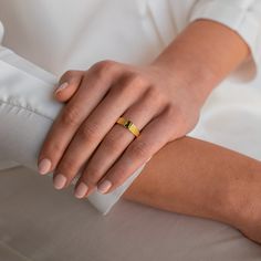 Be bold and beautiful while wearing our Olive Peridot Signet Ring. With a chunky textured band and a rectangle shaped green gemstone, this cocktail signet ring adds a colorful and eye-catching touch to your everyday look.• Material: High Quality Solid 925 Sterling Silver• Finish: 18K Gold• Featuring a thick ring band with a 4mm x 6mm CZ Peridot Gemstone SKU: RR-RR064 Yellow Gold Signet Ring With Rectangular Stone For Gift, Modern Gold Ring With Rectangular Stone, Modern Gold Signet Ring With Rectangular Stone, Initial Tag Necklace, Dainty Initial Necklace, Thick Ring, Initial Gifts, Tiny Diamond, Peridot Gemstone