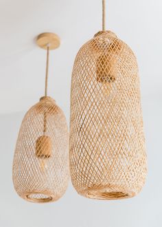 two wicker lamps hanging from the ceiling