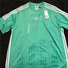 Brand New Never Worn Adidas Jersey Casual Green Adidas Tops, Adidas Green Top For Spring, Adidas Green Crew Neck T-shirt, Green Adidas Crew Neck T-shirt, Green Adidas Top For Spring, Green Crew Neck Top With Three Stripes, Green Short Sleeve Top With Three Stripes Branding, Green Casual Top With Three Stripes, Casual Green Top With Three Stripes