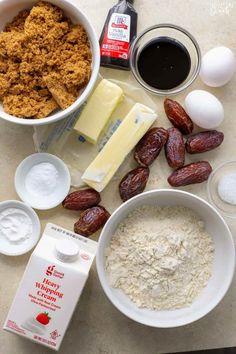 ingredients to make an oatmeal recipe laid out on a counter top, including milk, butter, eggs, and almonds