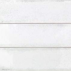 a white wall with three horizontal lines on it