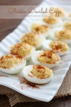 deviled eggs with cinnamon sprinkles on a plate