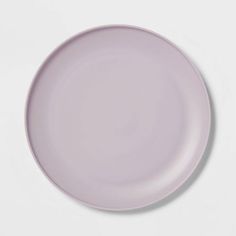 an empty purple plate on a white background