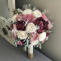 a bridal bouquet with pink and white flowers