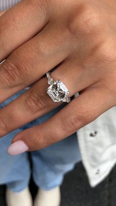 a woman's hand with a ring on it