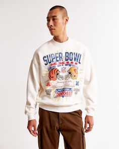 Step into the realm of nostalgia with the Abercrombie & Fitch Men's Vintage Super Bowl Graphic Crew Sweatshirt. Perfect for the sports enthusiast with a taste for retro style, this sweatshirt is a standout piece in any casual wardrobe.

- Size: XL TALL
- Color: White
- Material: Cotton, Polyester blend
- Gender: Male
- Features: Crew neckline, banded hem and cuffs, vintage Super Bowl-inspired graphic on the chest

Crafted from our exceptionally softAF fleece fabric, this oversized-fit sweatshirt Retro Oversized Tops For Game Day, Oversized Retro Top For Game Day, White Graphic Print Sweats For Streetwear, Collegiate Crew Sweatshirt With Graphic Print, Sports Season Embroidered Sweatshirt For Streetwear, Embroidered Graphics Sweatshirt For Sports Season Streetwear, Throwback Logo Print Sweatshirt For Fall, White Oversized Varsity Sweatshirt, Oversized White Varsity Sweatshirt