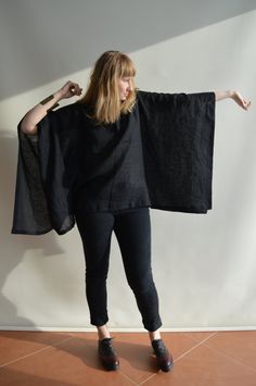 "Fantastic, airy poncho top made from 100% pure European linen. Wear this kimono inspired top as a classy addition to your formal wardrobe, or as a comfortable coverup for the leisurely day on the beach. Wear over a top or tee and you'll have a great boho look. Each piece is individually cut, sawn and pre-washed. We really love making garments for various sizes - from petit to plus size and more. For the best fitting of this top please let us know the following measurements: - your height - your Black Bohemian Poncho With Batwing Sleeves, Oversized Cape Top In Casual Style, Oversized Casual Cape Top, Spring Lagenlook Poncho With Batwing Sleeves, Black Batwing Sleeve Poncho For Spring, Casual One Size Cape Top, Casual One-size Cape Top, Oversized Bohemian Cape With Batwing Sleeves, Boho Poncho