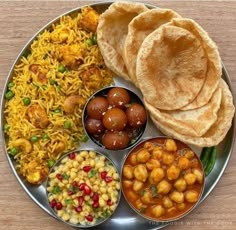 a metal plate topped with different types of food