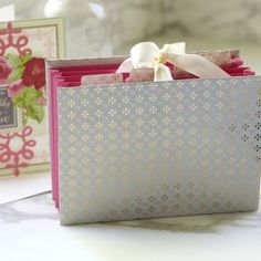 an open gift bag sitting on top of a table