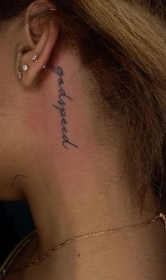 a woman with a tattoo on her neck