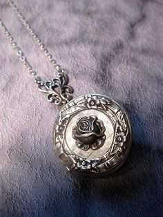 Silver Rose Locket Necklace The Locket measures 32mm round (1.25 inches round) Chain: - Silver Plated - YOU CHOOSE YOUR CHAIN LENGTH FROM DROP DOWN MENU TOOL ☻☻ TO see MORE of our LOCKET NECKLACEs (while supplies last): https://www.etsy.com/shop/FashionCrashJewelry/search?search_query=locket&order=date_desc&view_type=gallery&ref=shop_search ☻☻TO VIEW ADDITIONAL OPAL JEWELRY SELECTIONS: https://www.etsy.com/shop/FashionCrashJewelry/search?search_query=OPAL&order=date_desc&view Silver Round Pendant With Rose Design, Silver Necklace With Rose Design, Vintage Rose-colored Jewelry For Weddings, Vintage Rose Wedding Jewelry, Vintage Jewelry With Rose Design Flower Pendant, Adjustable Vintage Rose Jewelry, Vintage Rose Design Flower Pendant Jewelry, Vintage Rose Flower Jewelry, Vintage Rose Jewelry For Wedding