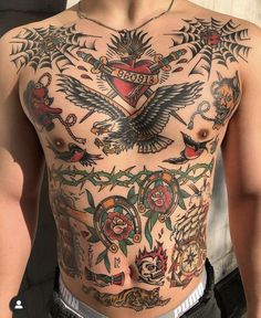 a man with lots of tattoos on his chest