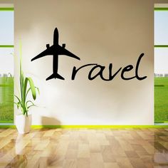 an airplane is flying in the sky with the word travel on it's wall