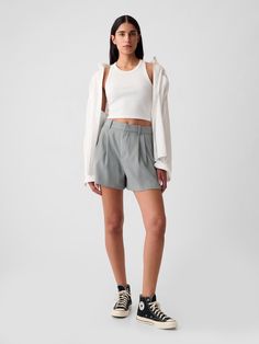 Soft woven tailored shorts.  E-waist with concealed hook and bar closure, zip fly.  Front slant pockets, back welt pockets.  Pleating at front.  * Fit: Relaxed.  An easy silhouette throughout.  Hits above the knee.  Inseam: 4" 10 cm) ​​ Model is approx.  5’10” wearing High Tops And Shorts, Trouser Shorts Outfit, Sporty Shorts Outfit, Tailored Shorts Outfit, Grey Shorts Outfit, Athletic Shorts Outfit, Spain Outfit, Trouser Shorts, Outfits New York