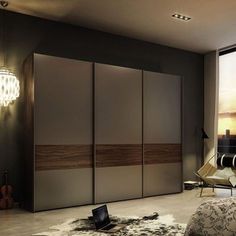 a bedroom with a large bed and sliding closet doors in it's center area