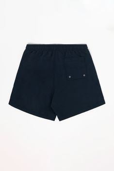 This classic cut men's swim trunk is fully lined with our comfort mesh liner. Unlike traditional swim trunks, our liner extends to the bottom of the shorts, which have a 4.5" inseam. This style features 2 deep side pockets and one back pocket with eyelets for drainage and a velcro seal so the shorts are functional in and outside of the pool. Also features a drawcord on the inside to adjust the waistband. Made in Los Angeles, Calif. Our experienced seamstresses earn an average up to $20 an hour o Summer Nylon Swim Trunks With Side Pockets, Short Swim Trunks With Pockets For Beach Season, Cotton Swim Trunks With Built-in Shorts For Pool, Relaxed Fit Swim Trunks With Pockets For Beachwear, Navy Shorts For Poolside, Solid Color Relaxed Fit Swim Trunks For Beach Season, Beachwear Swim Trunks With Side Pockets For Summer, Swim Trunks With Built-in Shorts Relaxed Fit, Solid Swim Trunks With Built-in Shorts Relaxed Fit