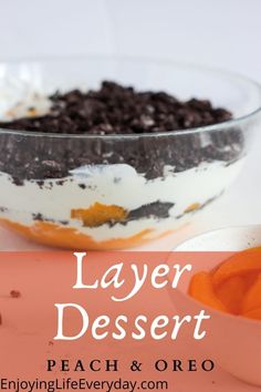 layered dessert with whipped cream and chocolate chips in a glass bowl on an orange plate