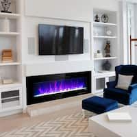 a living room with a large television mounted on the wall and a fire place in front of it