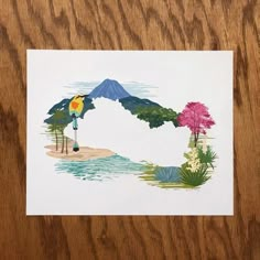 a piece of paper with an image of a bird standing on the edge of a body of water