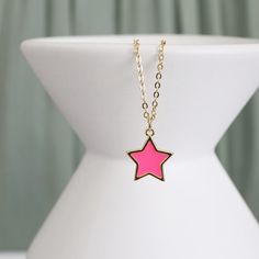 "Beautiful and lovely pink star charm necklace.  Made of dainty neon pink enamel star charm with skinny gold plated brass chain.  The simple and natural-looking dainty necklace is good for yourself or gift! Your necklace will ship in a rudiana gift box. ♥ Gold Plated over Brass / Neon pink enamel ♥  Chain length 14\" - 20\"   ♥  Pink star charm 1/2\"   ♥  Creation Time: 1 - 3 days  ♥ US shipping transit time: 3-5days    ♥  See more Rudiana Accessories  Rudiana.etsy.com" Dainty Pink Charm Necklace With Delicate Chain, Dainty Pink Charm Necklace With Adjustable Chain, Trendy Pink Necklace For Birthday, Pink Star Charm Jewelry For Gift, Trendy Pink Necklace With Star Charm, Trendy Pink Jewelry With Star Charm, Trendy Pink Star-shaped Jewelry, Pink Star Charm Jewelry, Cute Pink Jewelry With Star Charm