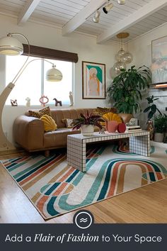 a living room filled with lots of furniture and decor on top of a hard wood floor