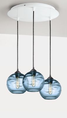 three lights hanging from a ceiling in a room