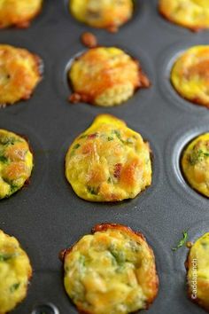 several muffins in a pan with different toppings